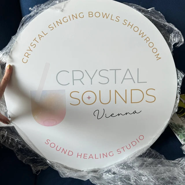 Round acrylic sign for a spa and wellness studio