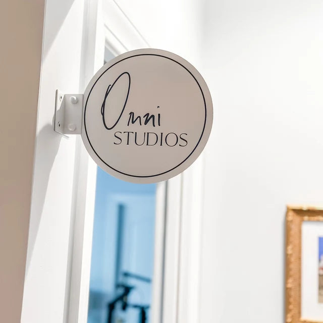 Minimal round interior door sign for a studio office