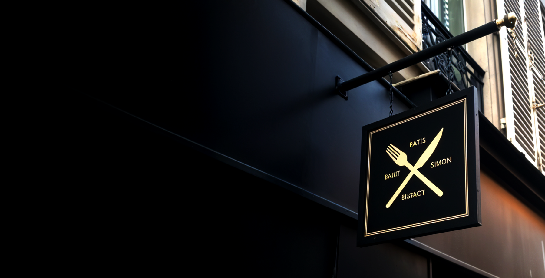 Projecting blade sign outside a restaurant and bistro